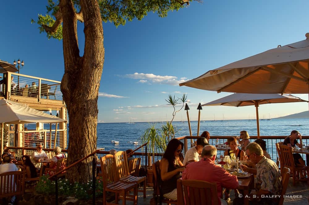 Image depicting people in an oceanfront restaurant, one of the top 10 reasons to fall in love with Maui