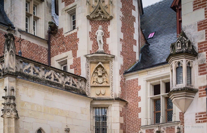 Brick and tufa stone façade at Chateau Clos Luce