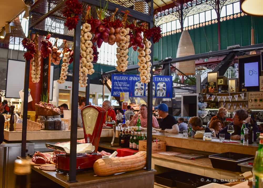 tall countertops with people seating around at Mercato Centrale