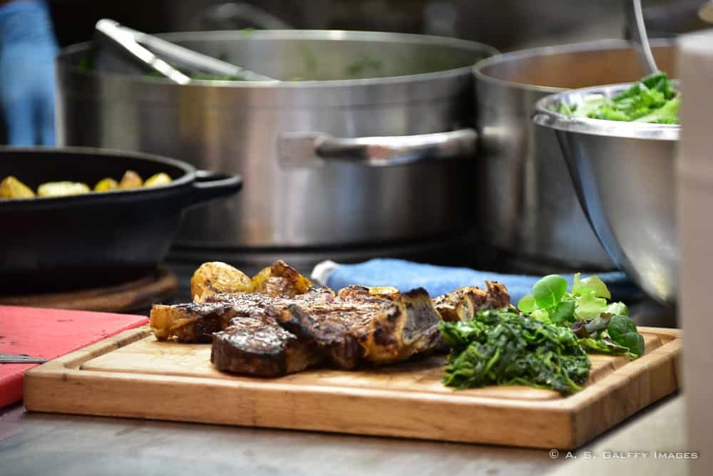 roasted beef and salad on a wooden board