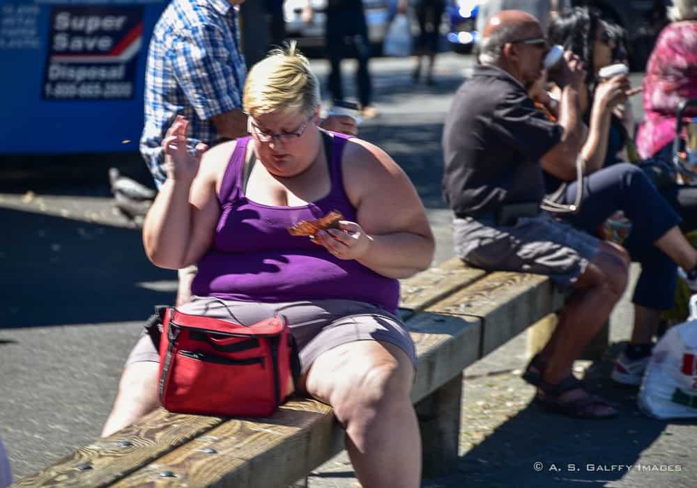 Obese woman eating - a culture shock in America