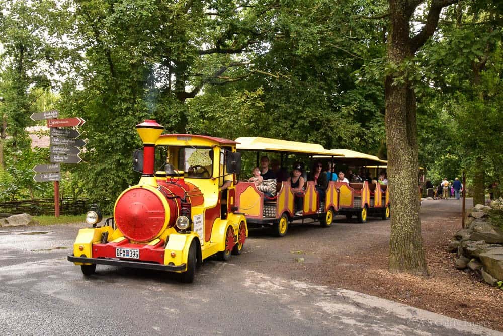 Small train carrying people around Scansen open air museum