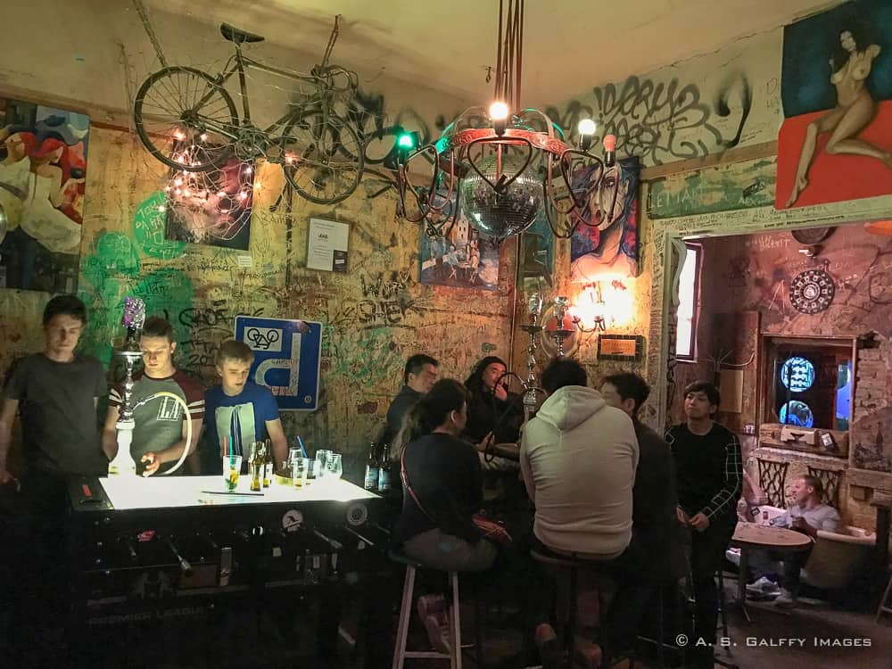 young men sitting at a counter in the Ruin Pubs