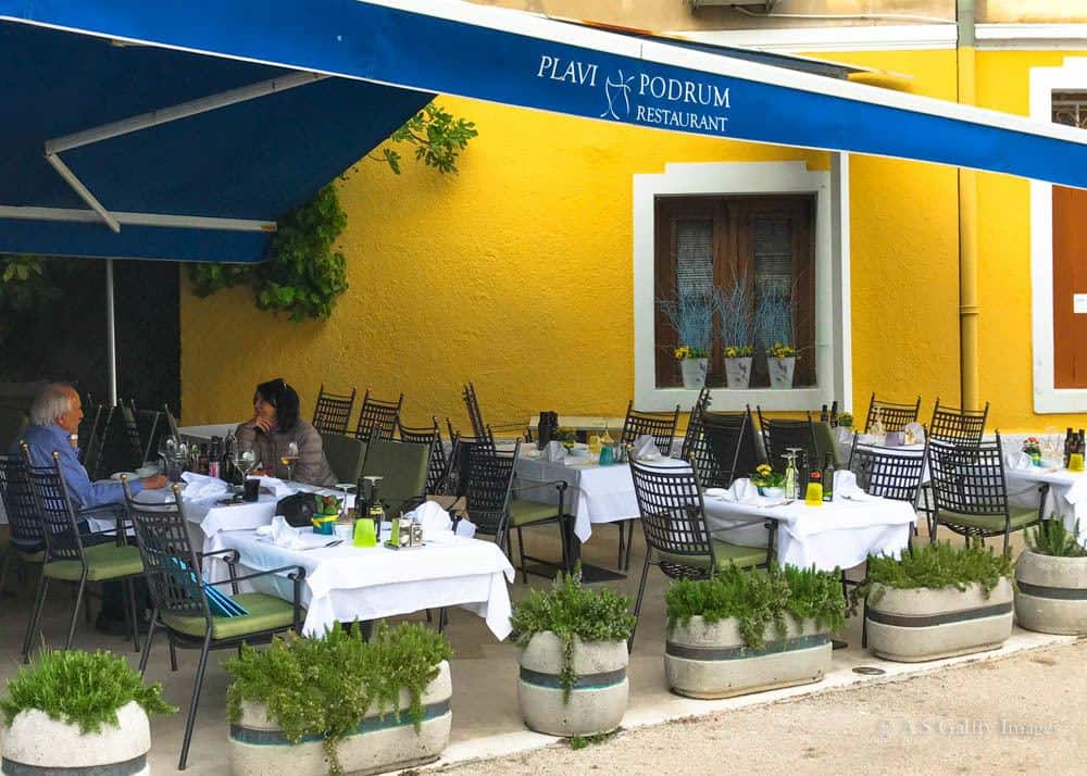 View of Plavi Podrum restaurant that you'll encounter when strolling Lungomare