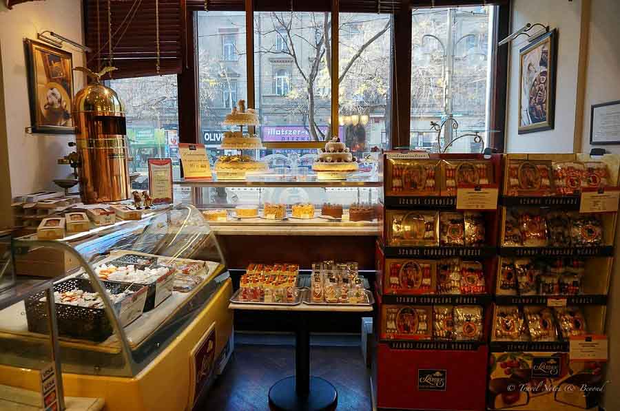 The shelves at Szamos, piled with cakes and marzipan creations