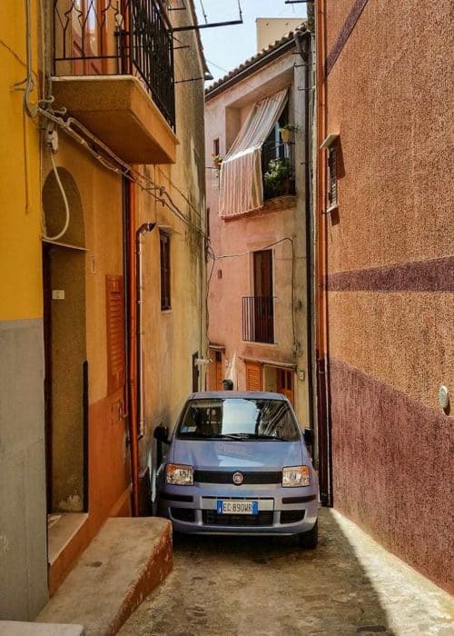 Car parked in narrow alley in Sicily