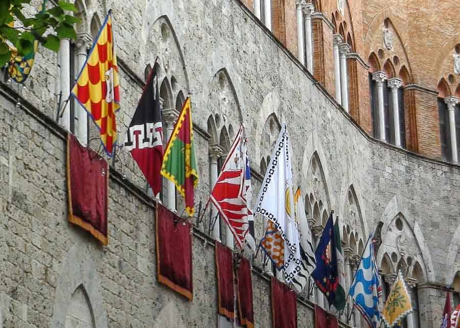 Contrade flags during Palio di Siena horse race