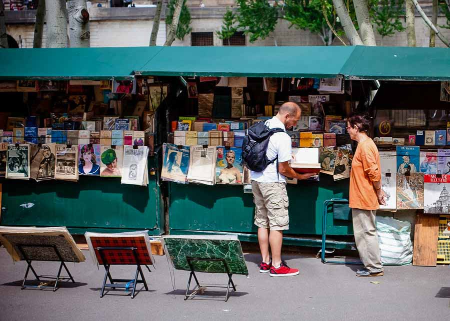 Buying odd French souvenirs from the riverside Bouquinistes