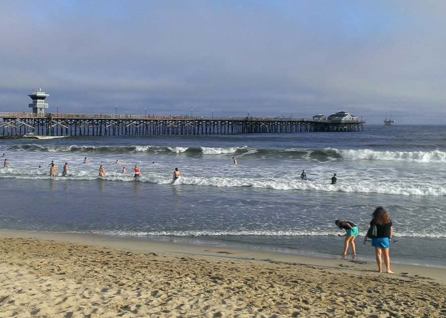 People playing in the water at Seal Beach