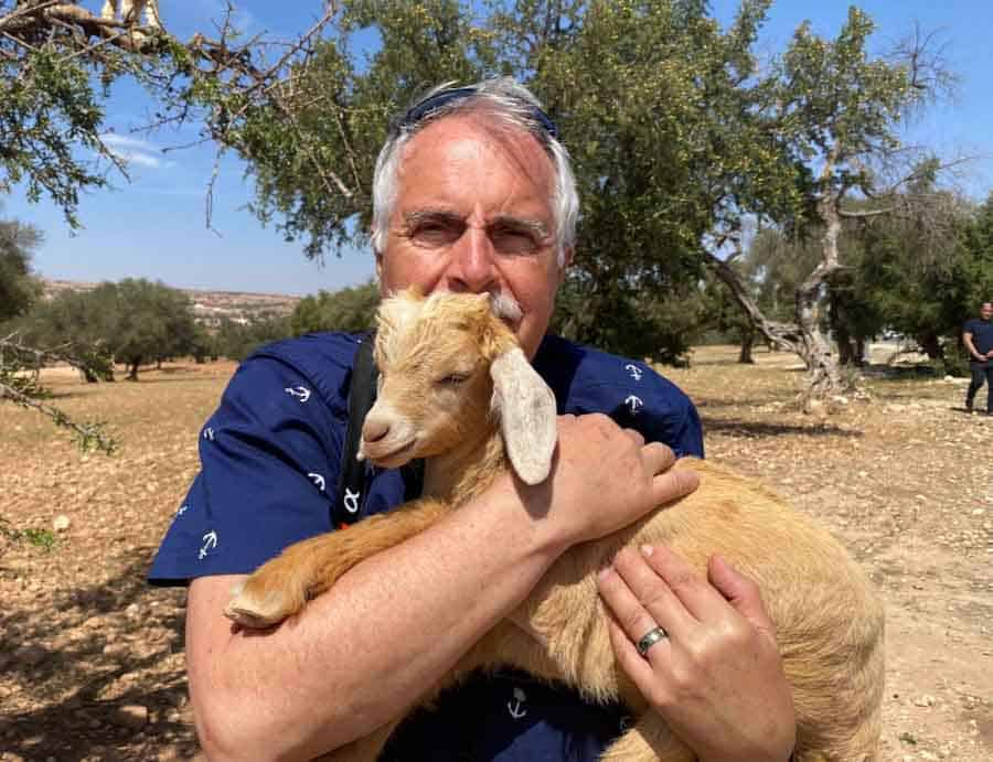 Posing with a baby goat in Morocco