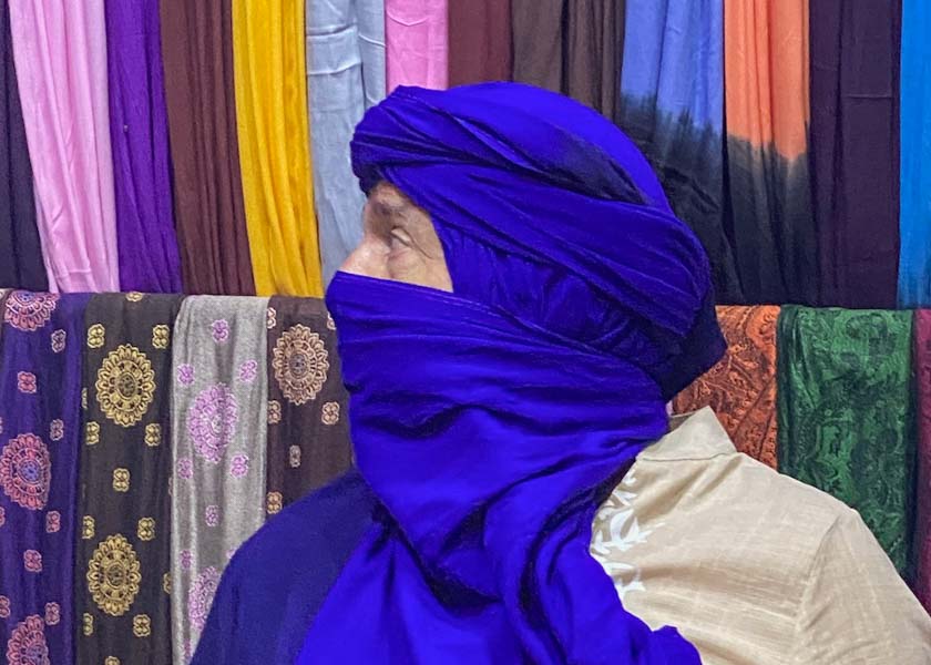 Buying turban scarfs as souvenirs from Morocco