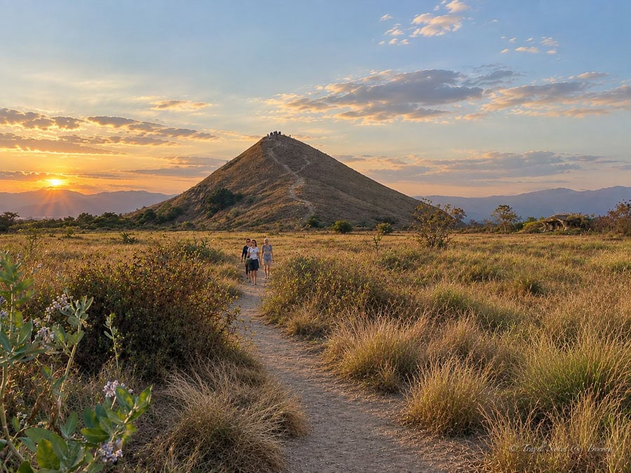 women walking from the viewpoint in Kenawa Island